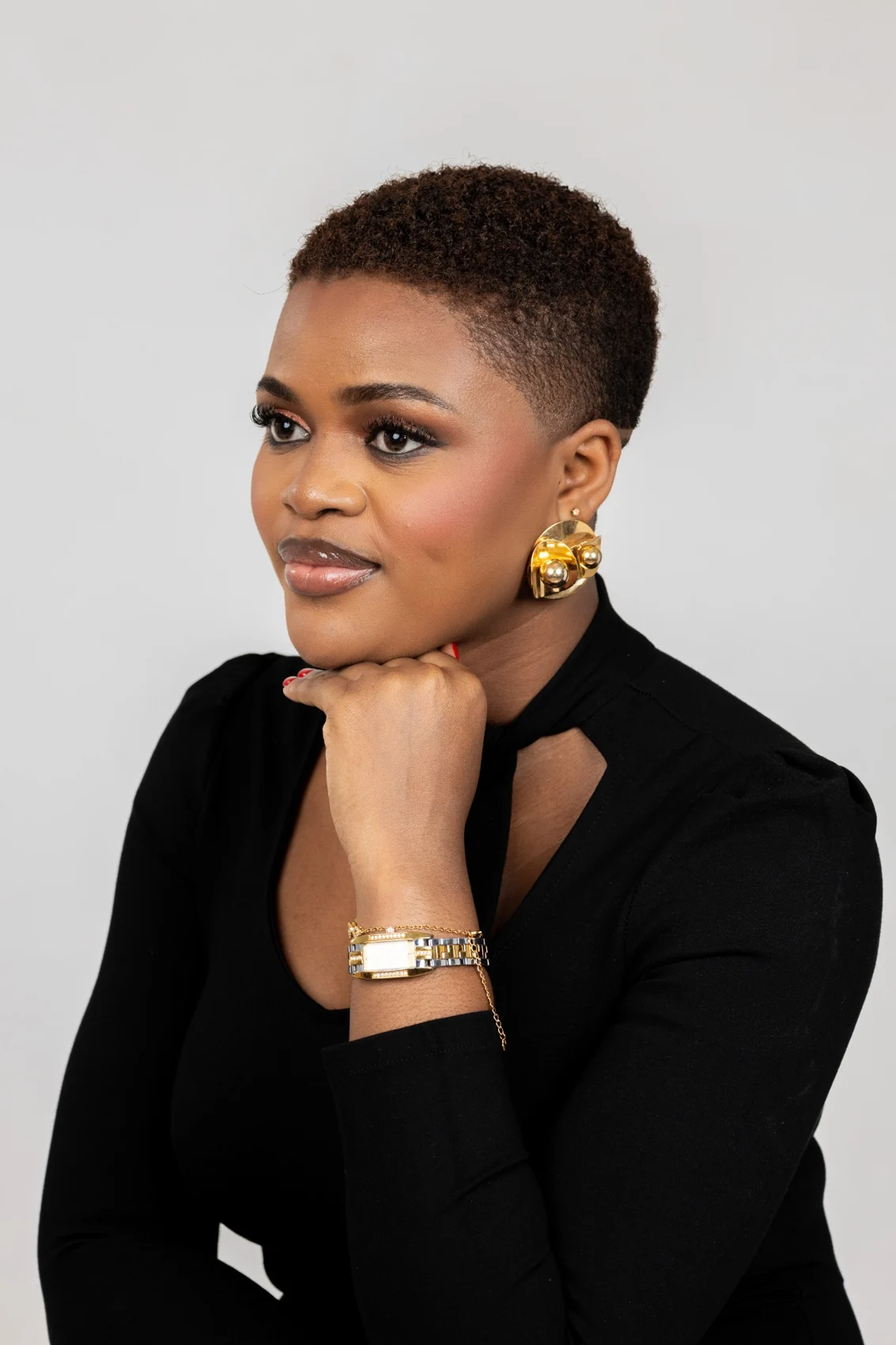 Kweyakie in a black studio portrait